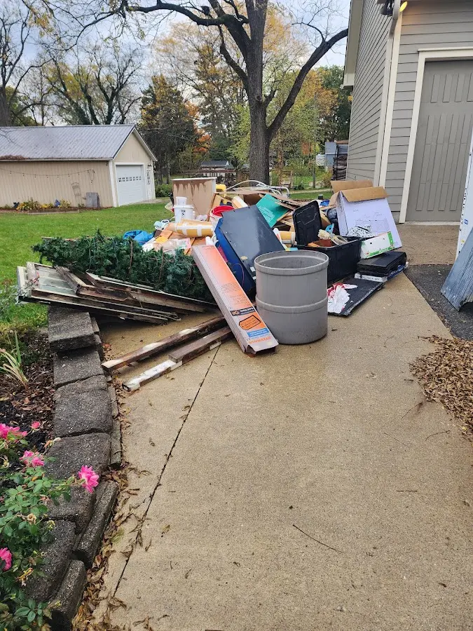 Dumpster being loaded with debris for 3 Yard Dumpster Rental in Shingle Springs